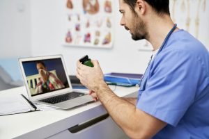 Sick patient on a video call with a doctor